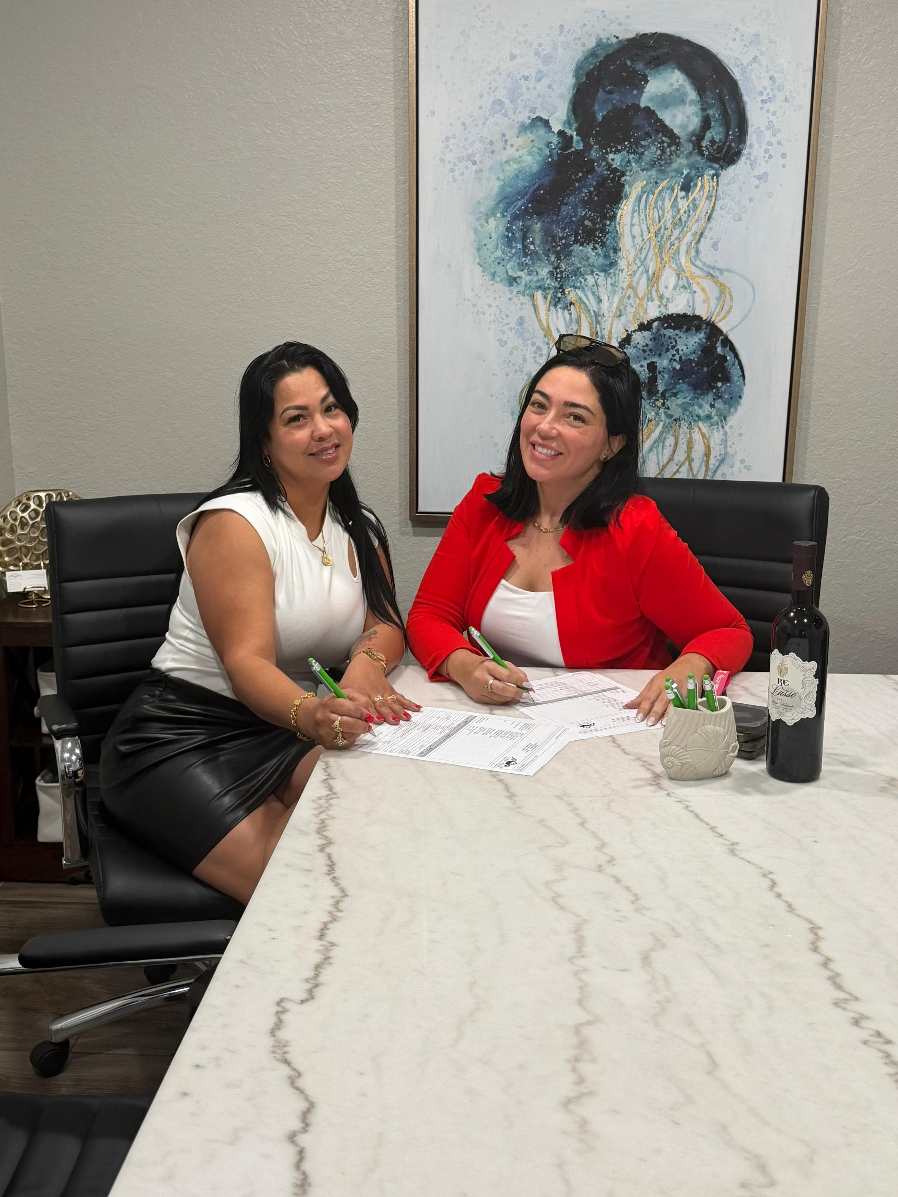 Lazara Diaz Tampa Bay Realtor guiding home buyers through document signing